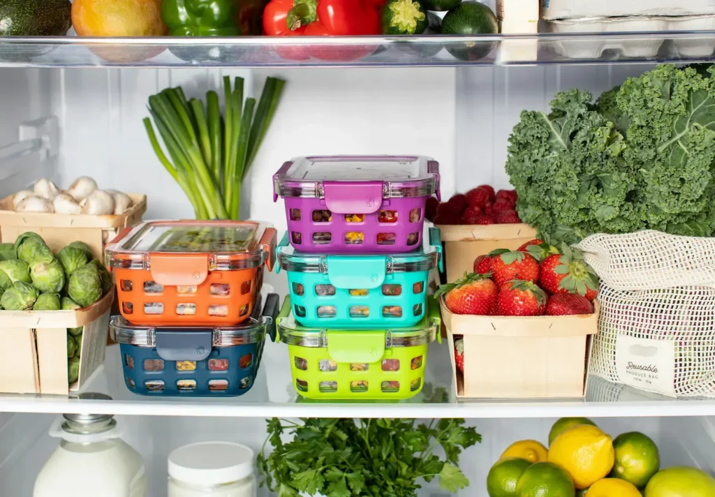 Fresh food being stored in sustainable containers in a fridge - clean swaps for the home