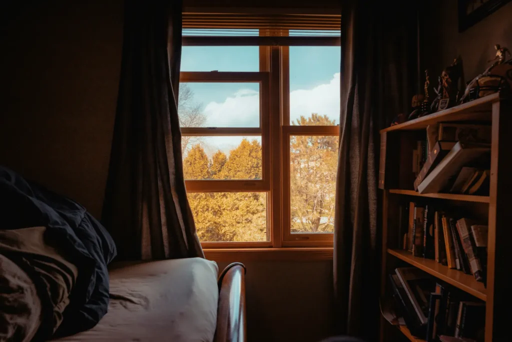 Bedroom window opened to let fresh air in avoiding everyday chemical exposure