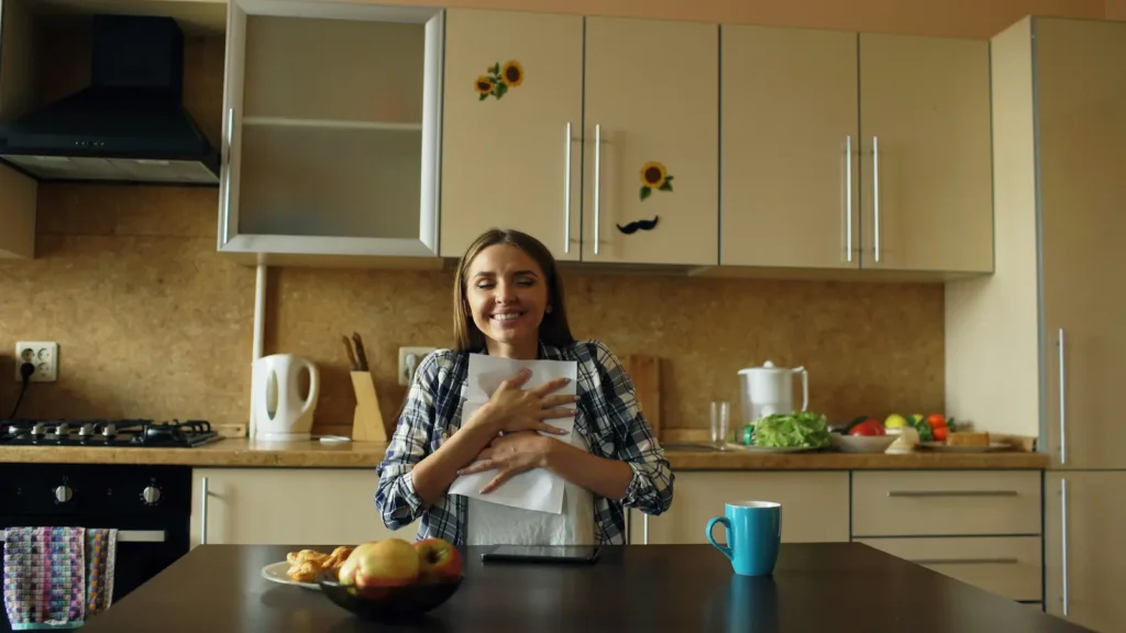 Happy woman holding a printed checklist on how to reduce toxins naturally