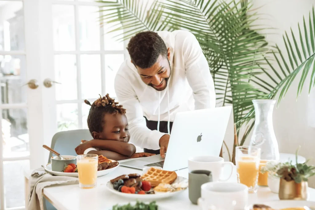 Father and son having breakfast. Family wellness environment.